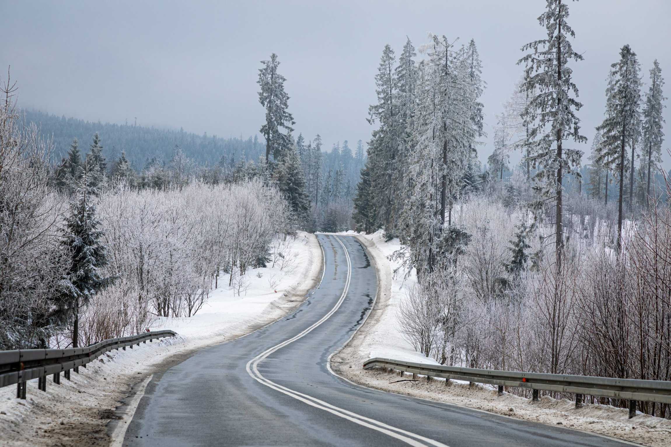 Stunning black asphalt road leading to mountain